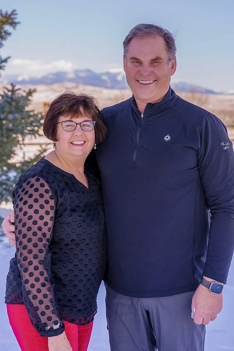 Doug and Debbie with mountains in the background